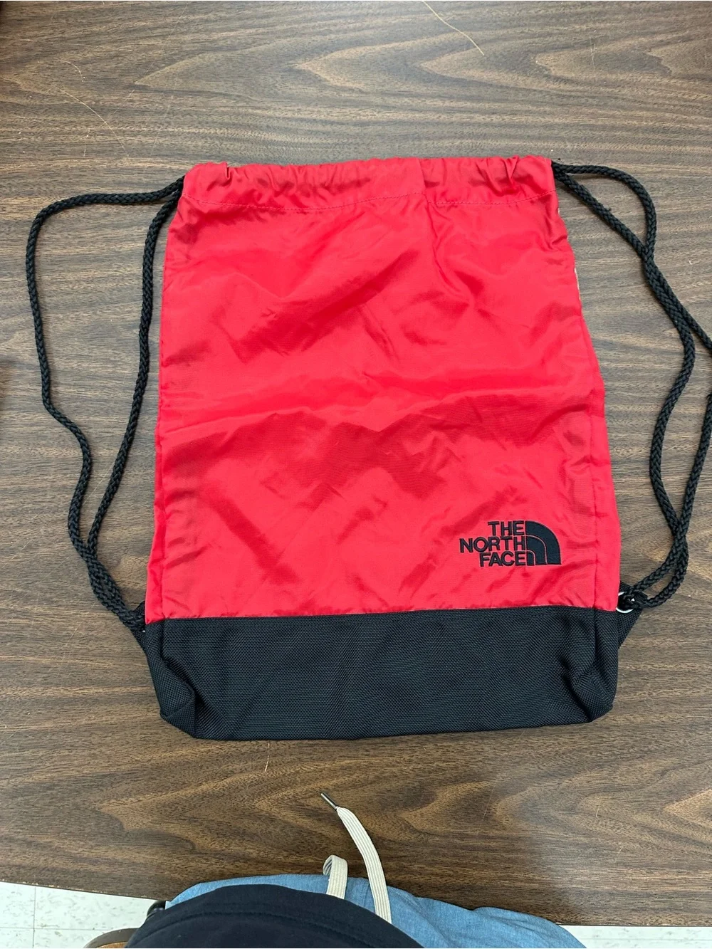 The North Face Red and Black Drawstring Backpack